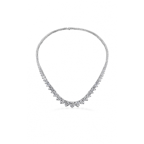 A close up of a diamond necklace with a symmetrical design, featuring pear-shaped diamonds set in a white gold chain.