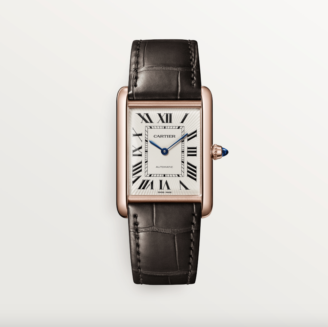 A Cartier wrist watch with leather brown bracelet and rose gold case.