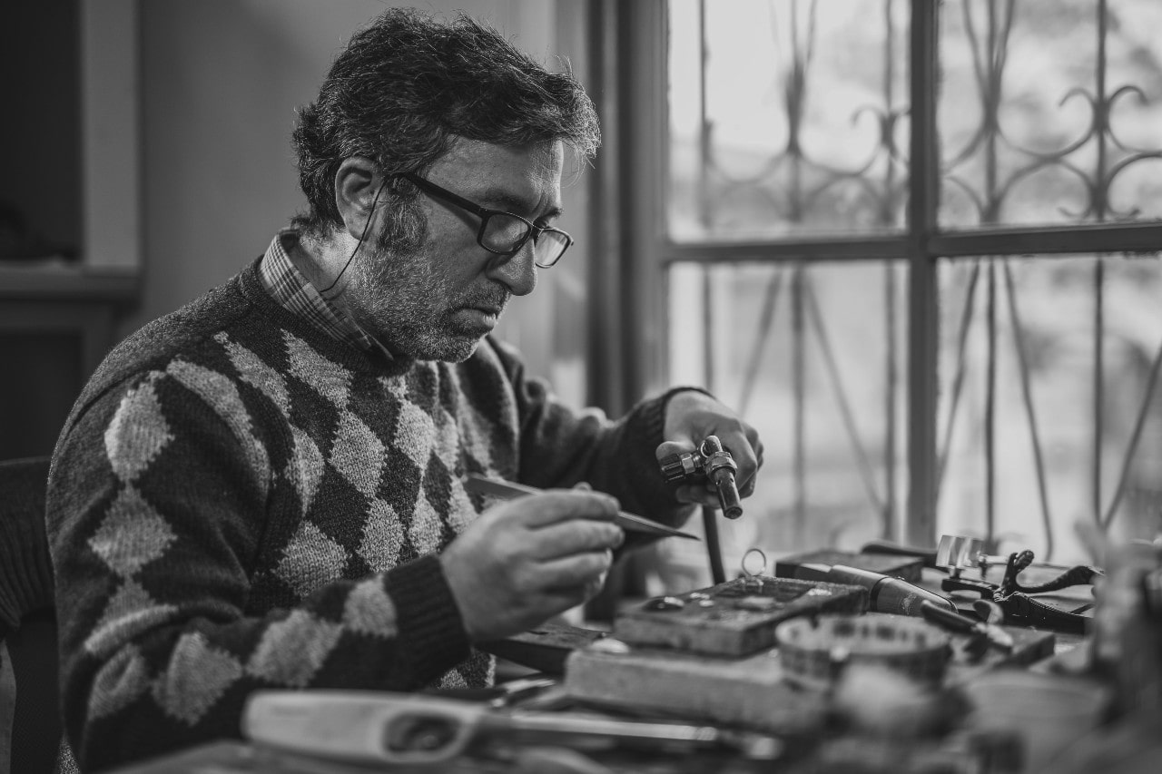 An expert craftsman designing a custom ring. An expert craftsman designing a custom ring.